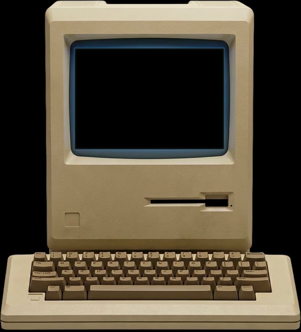 Ordinateur Macintosh vintage posé devant la mer